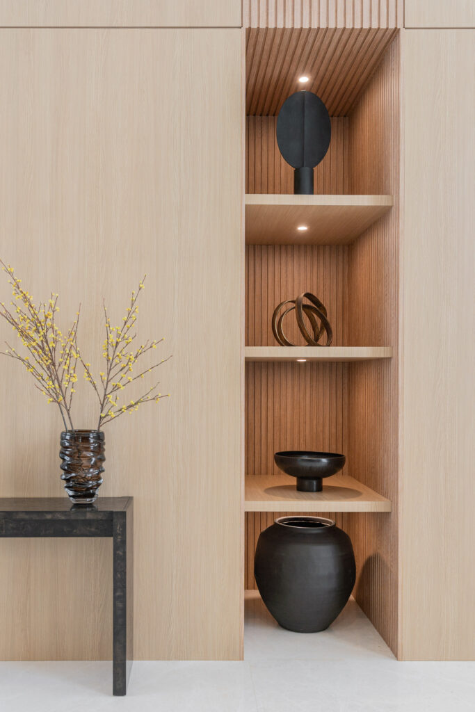 a shelf with a vase and vase on it