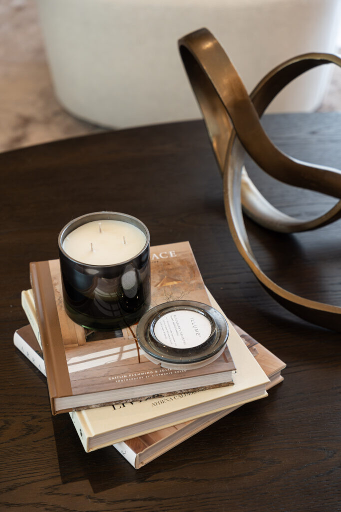 a candle on a stack of books