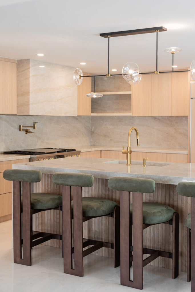 a kitchen with a sink and stools - blog edit